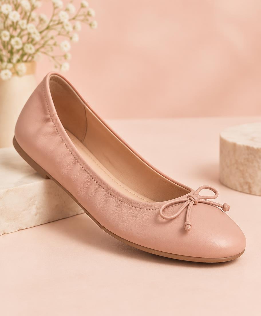 Women's blush leather ballet flat with a delicate bow